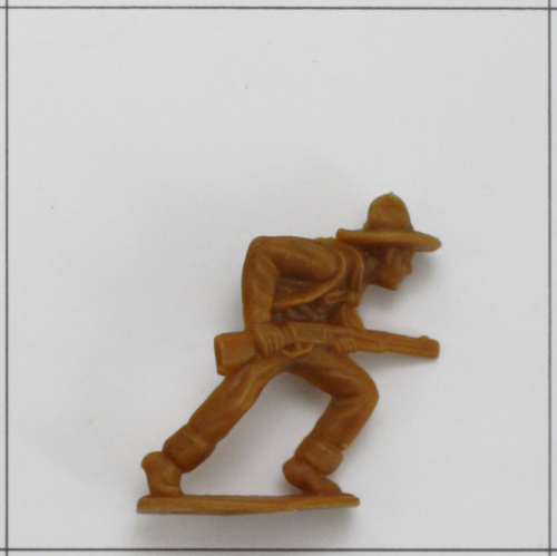 Cowboy laufend mit Gewehr im Anschlag, (K) Beige/braun/rotbraun